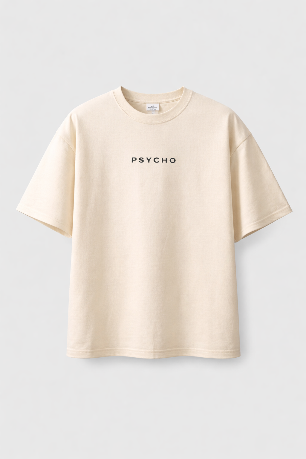 Beige t-shirt with 'PSYCHO' text on a light gray background