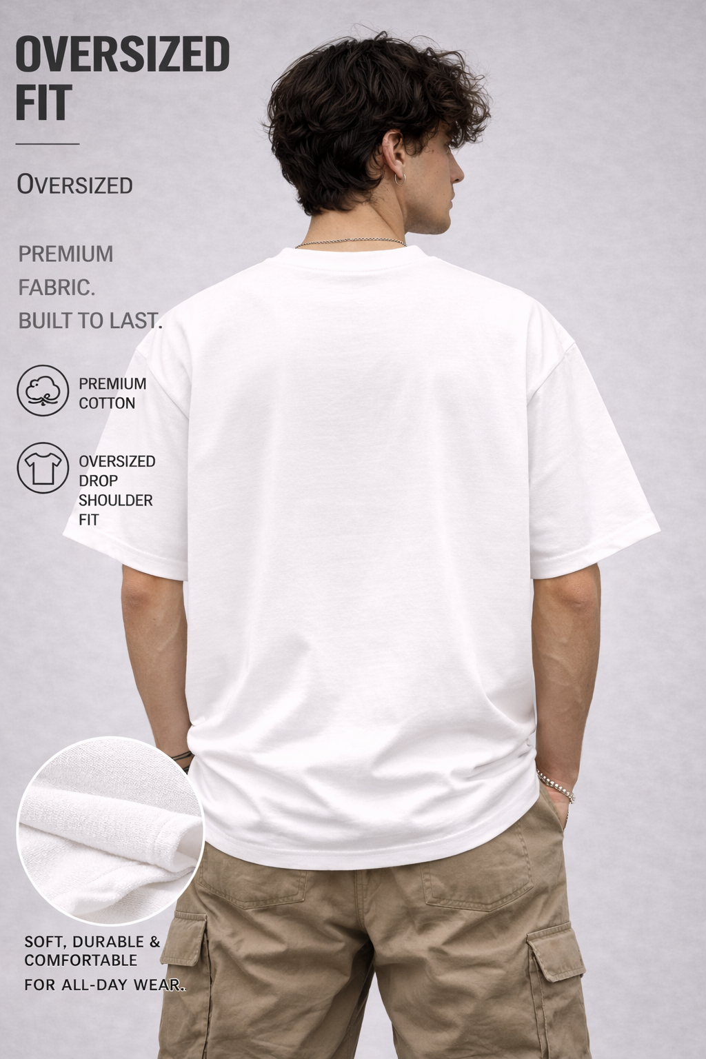 Person wearing an oversized white t-shirt with text and icons on a gray background