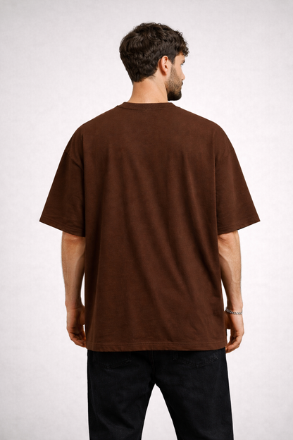 Man wearing a brown t-shirt on a white background
