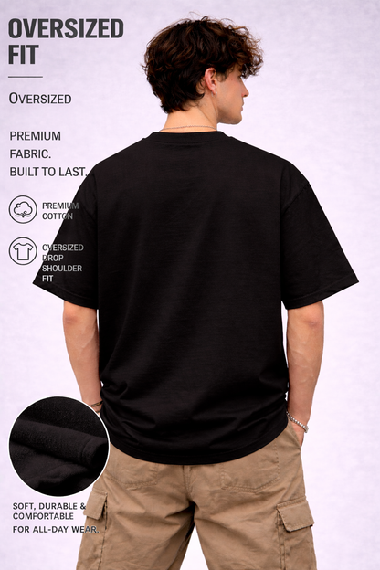 Person wearing an oversized black t-shirt with text detailing features on a white background