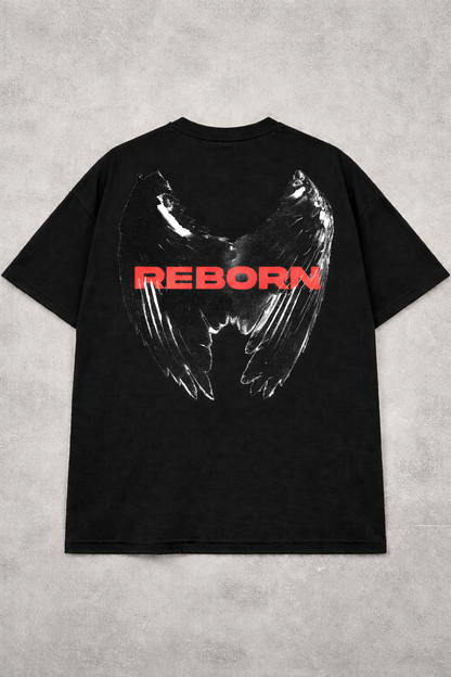 Black t-shirt with wings and 'REBORN' text on a gray concrete background