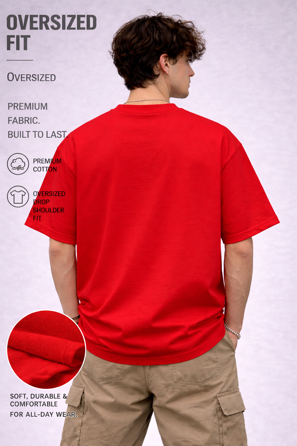 Person wearing an oversized red t-shirt with text and fabric detail on a light gray background