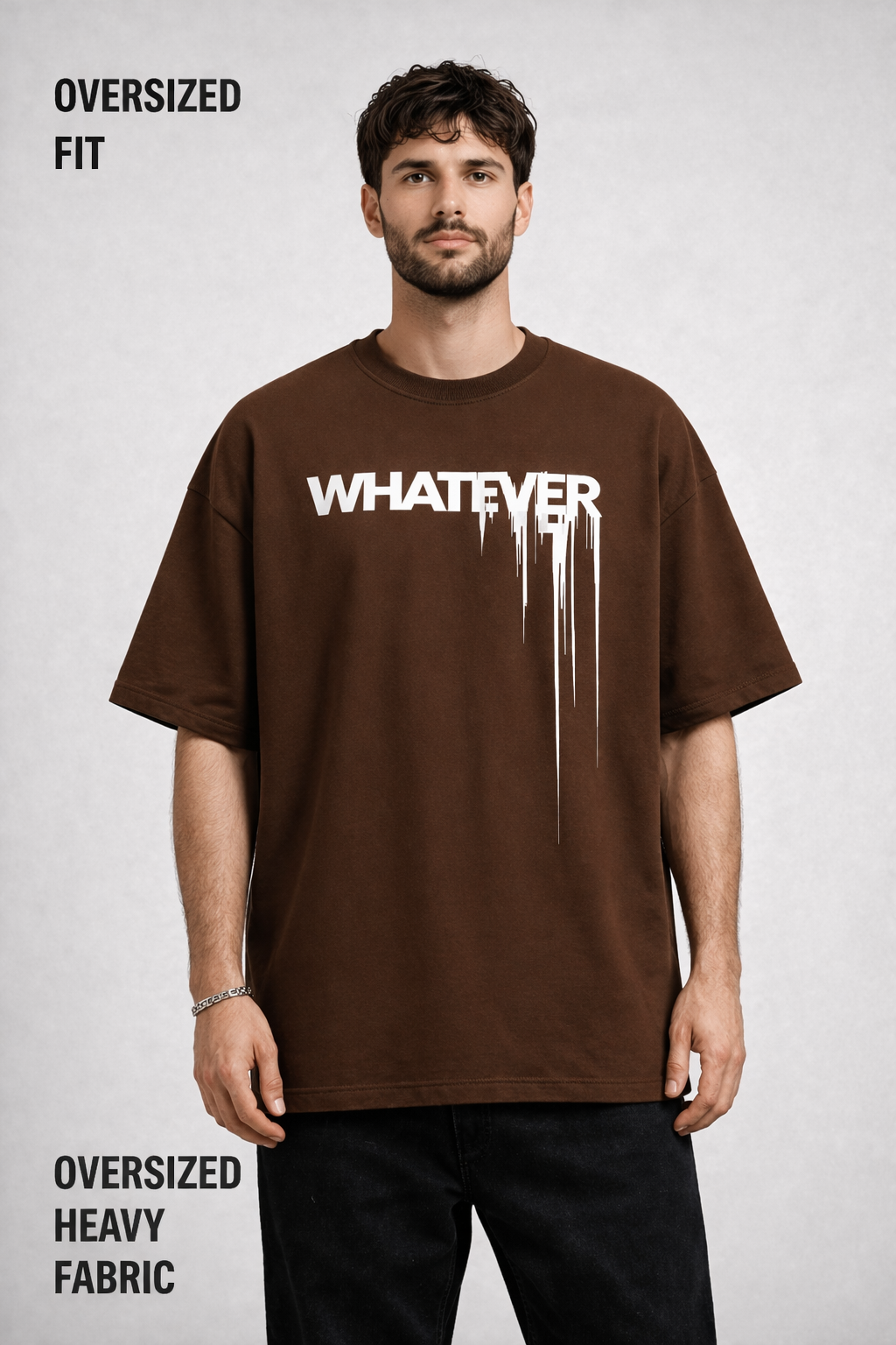 Man wearing an oversized brown t-shirt with 'WHATEVER' text on a light gray background