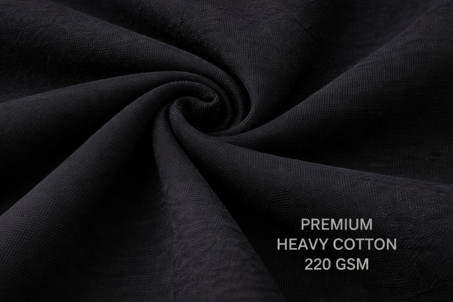 Close-up of black premium heavy cotton fabric with weight information.