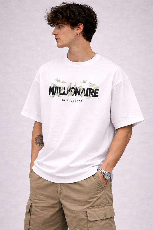 Person wearing a white t-shirt with text and beige cargo pants on a plain background